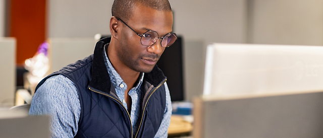 A person looking at a computer screen