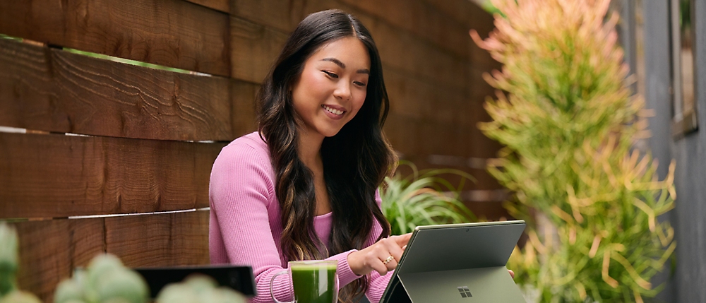 A person sitting outside using a computer