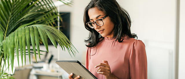 A person holding a tablet