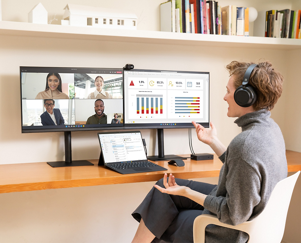 A person sitting in front of a computer screen during a video call