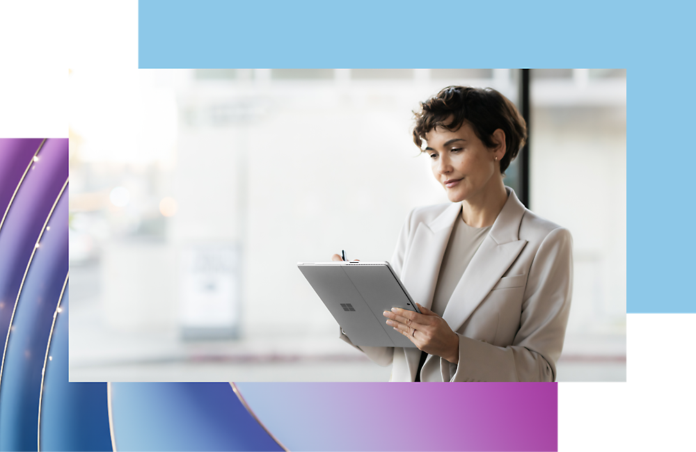 A professional woman in a white blazer taking notes on a clipboard in a modern office setting with blurred background.