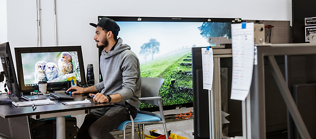 A person sitting at a desk with a computer