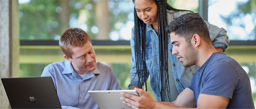 Three people engaged in a discussion. 