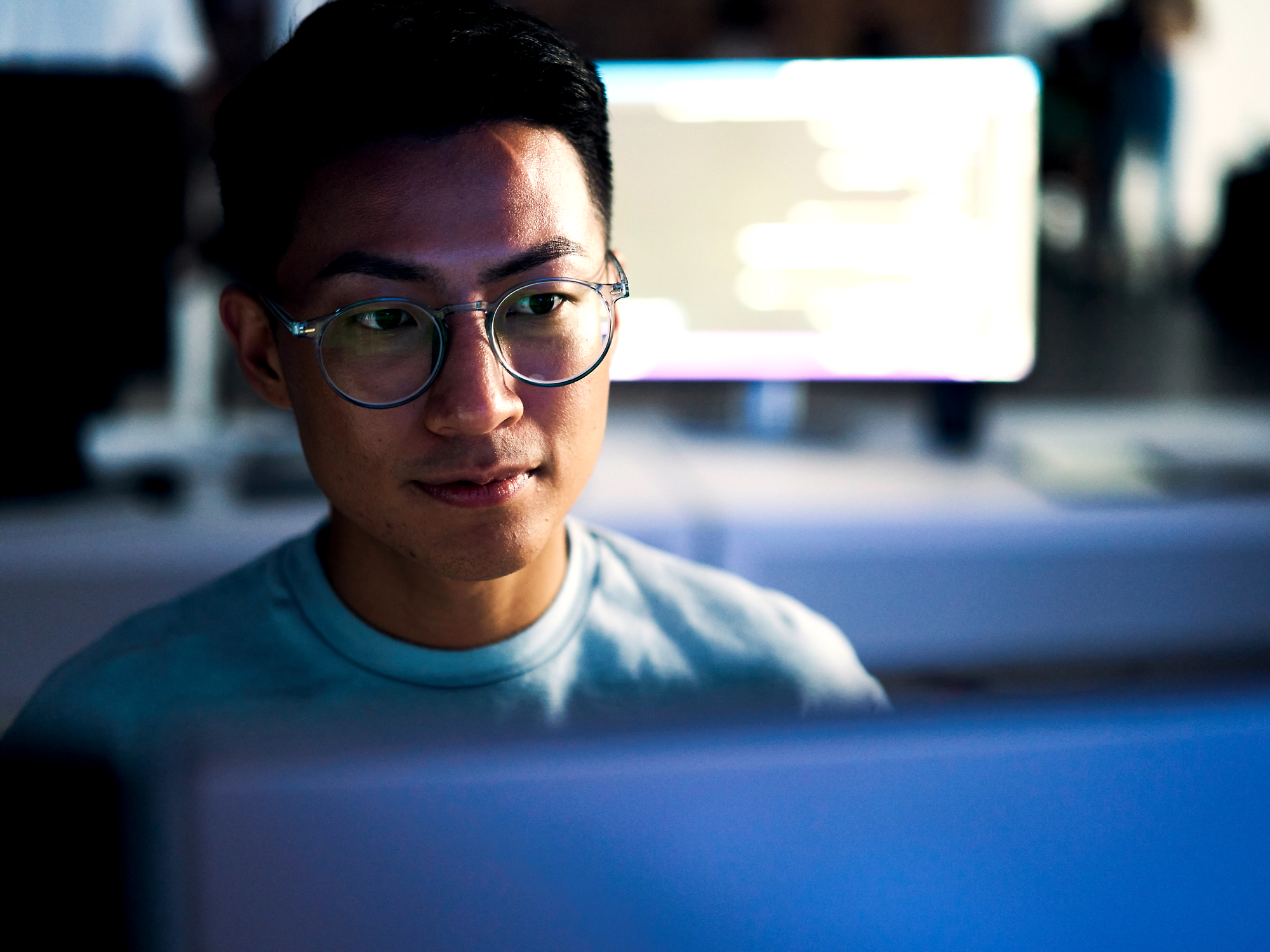 A person looking at a computer screen