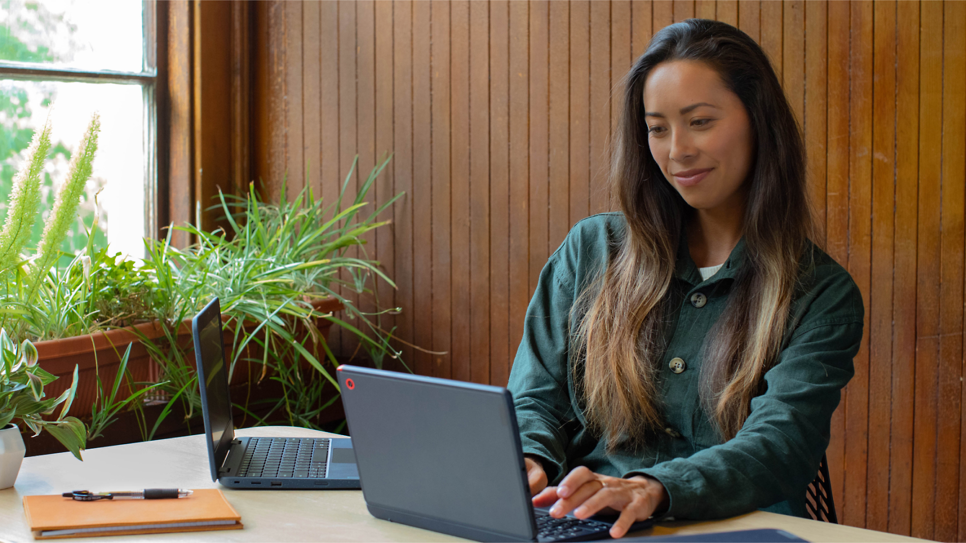 A person sitting at a desk working on Laptop