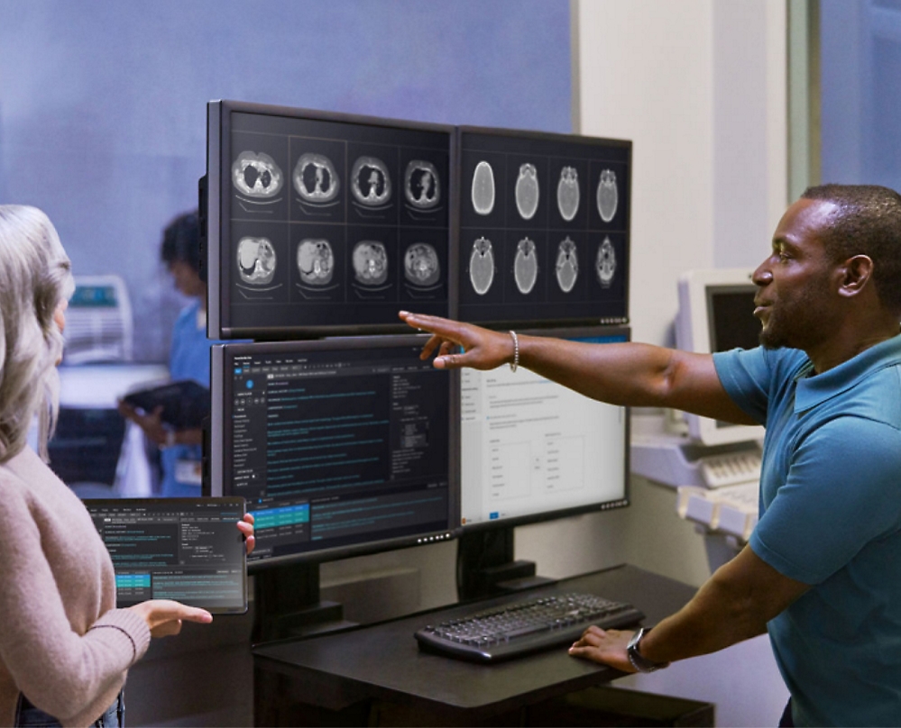 A person pointing at a computer screen