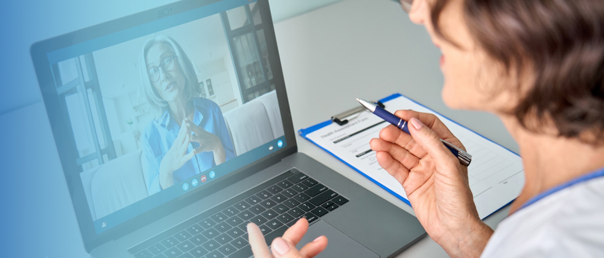 A person using a computer and talking with someone on videocall