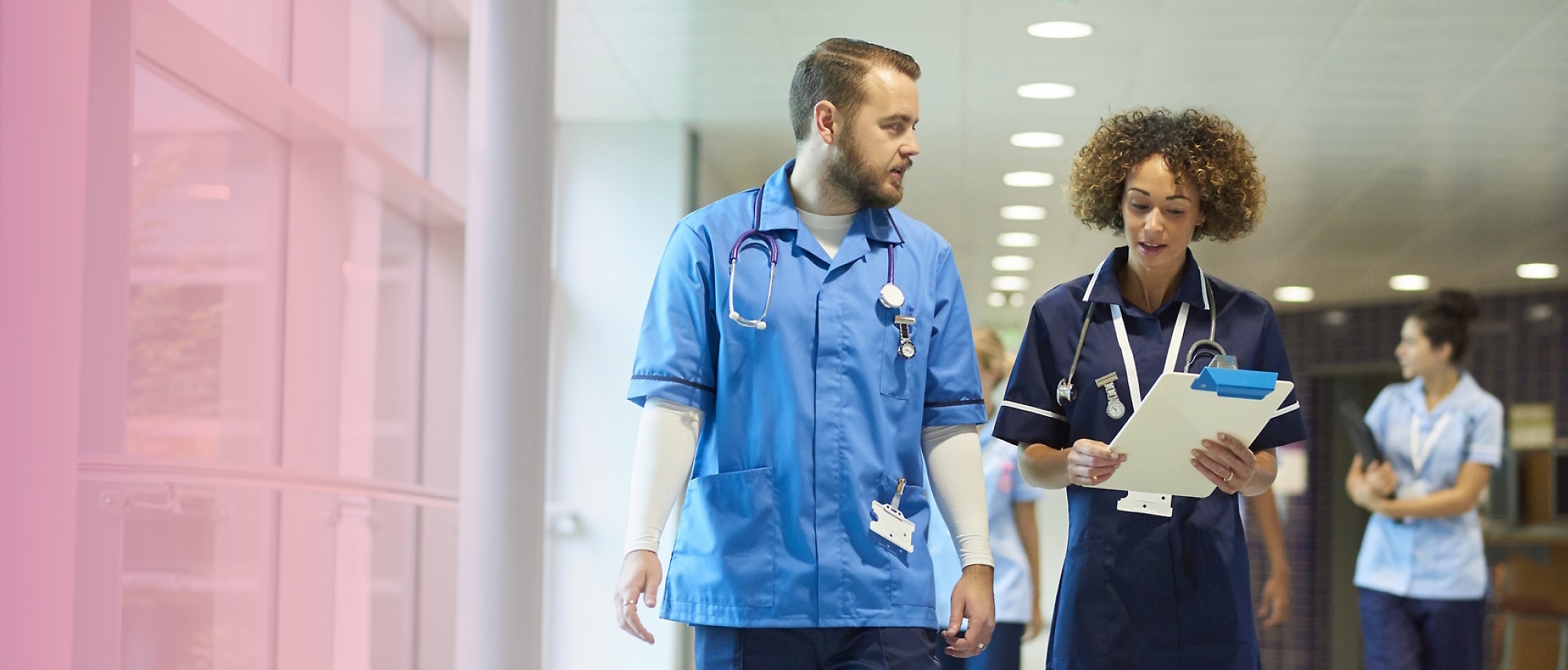 A person and another person wearing scrubs