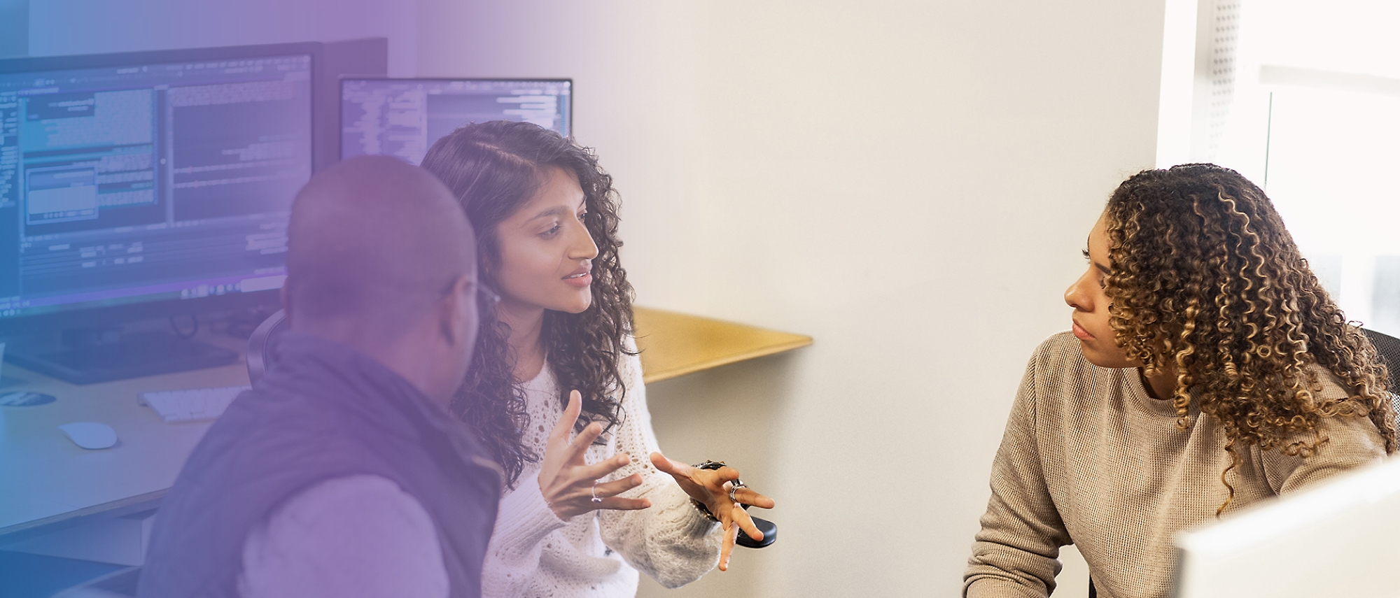 A person talking to a group of people