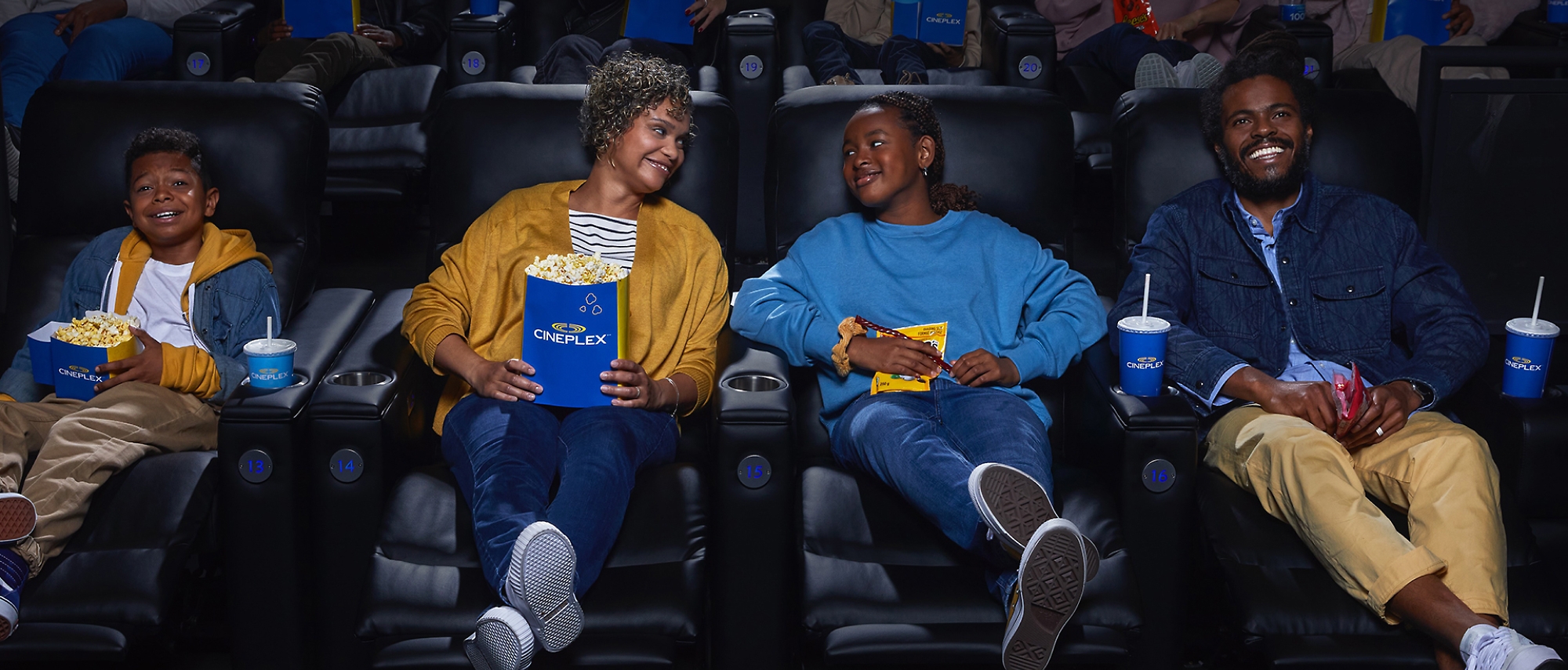 A group of people sitting in a theater