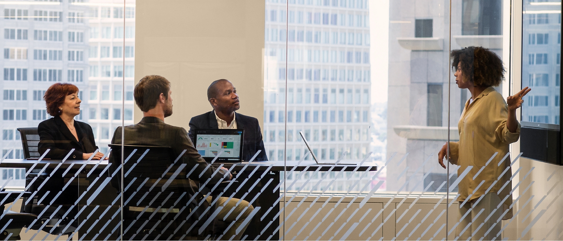 A group of people discussing something in a conference room