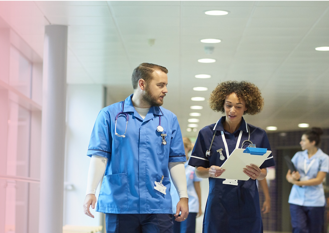 A couple of doctors in blue scrubs