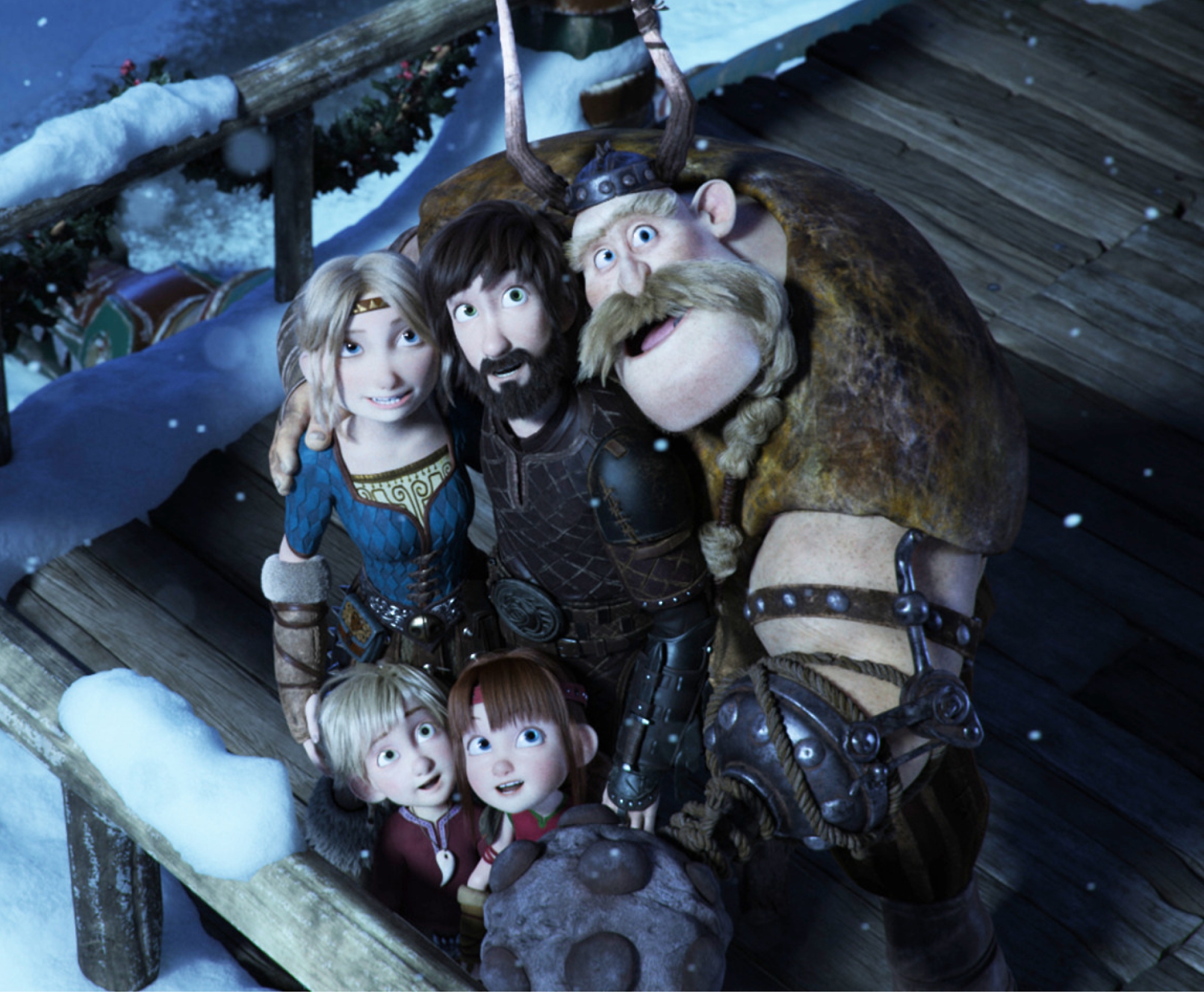 A group of animated Viking characters stands on a wooden deck in a snowy setting. The characters include a man, a woman, two small children, and a large man with a mustache and horns on his helmet.