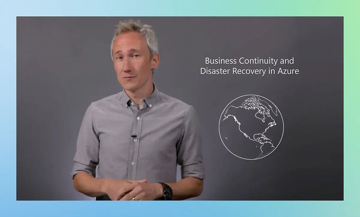 A person stands and gestures while presenting a topic titled "Business Continuity and Disaster Recovery in Azure.