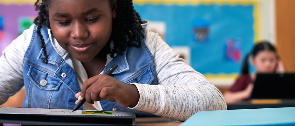 A child drawing on a tablet.