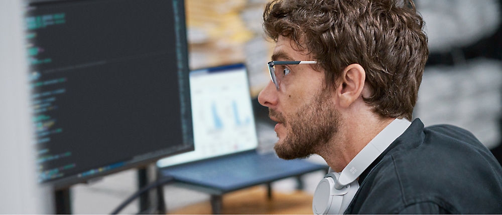 A person looking at a computer screen.