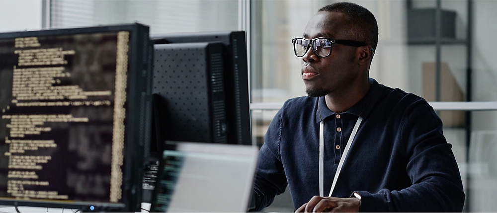 A person sitting at a desk with a computer