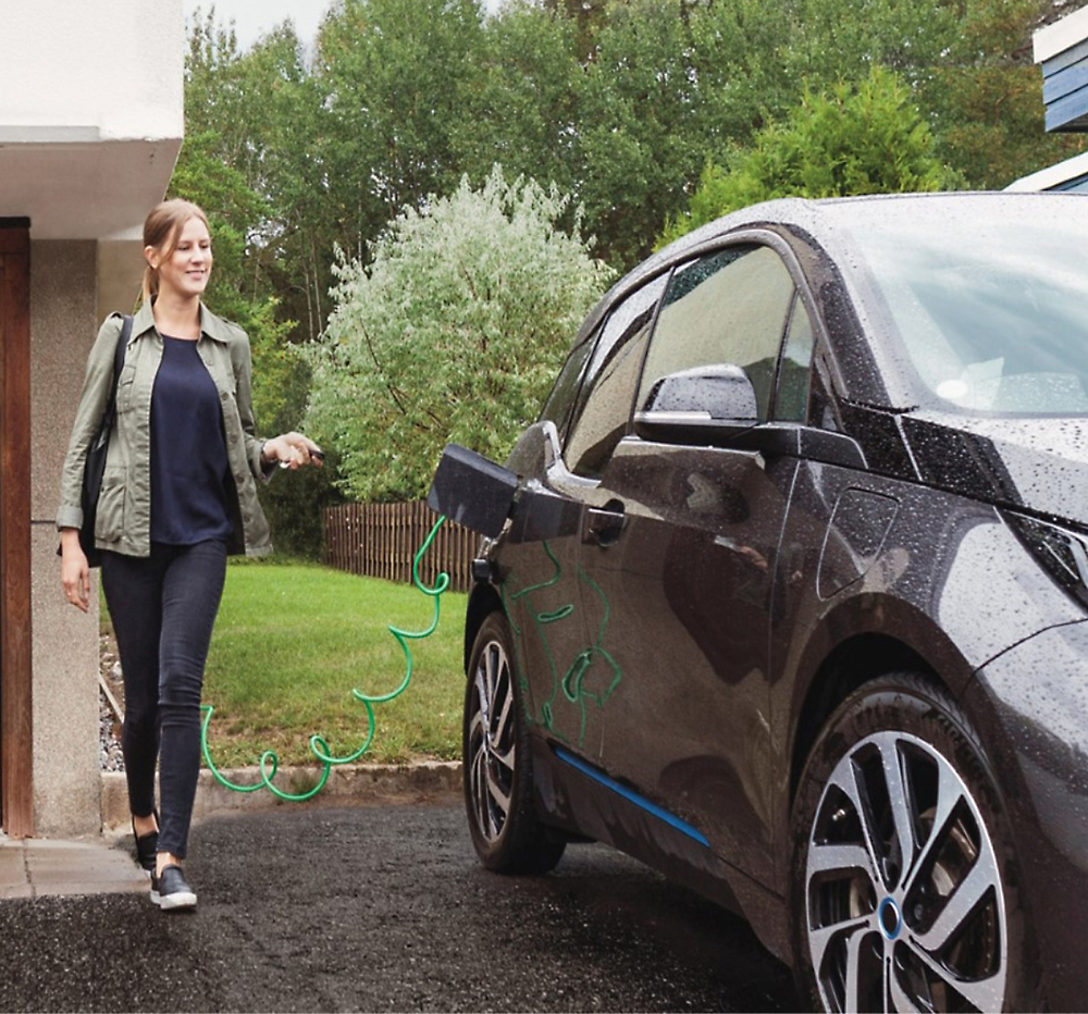 A person charging a car