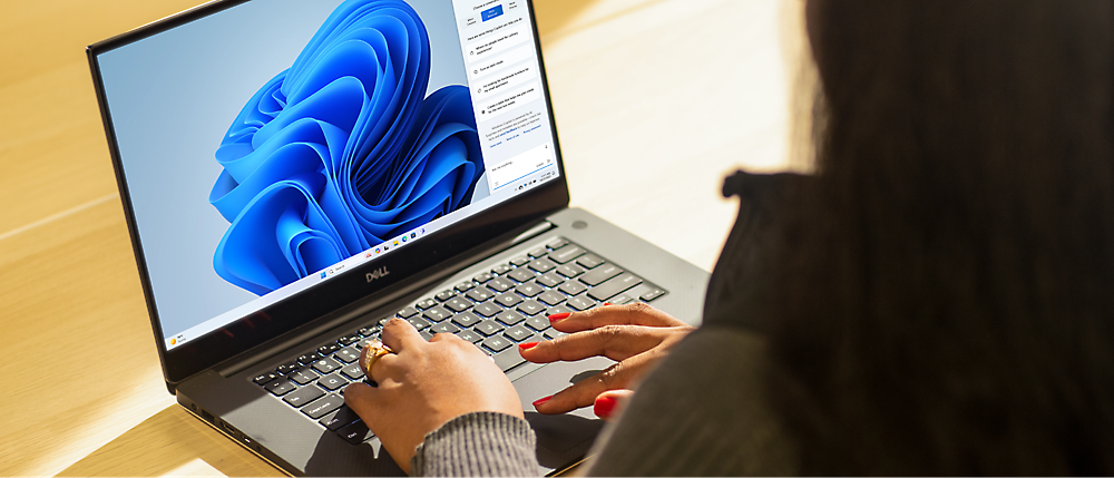 A person typing on a laptop