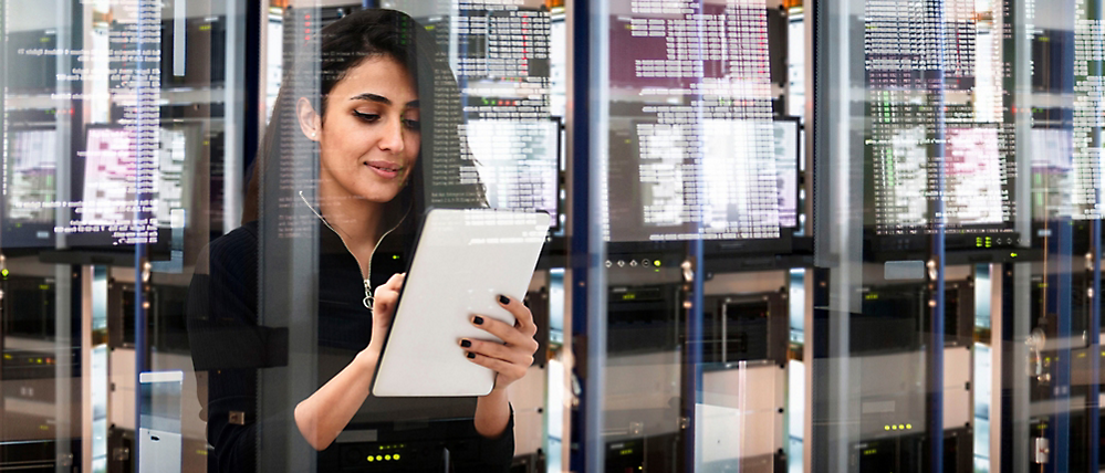 A woman holding a tablet.