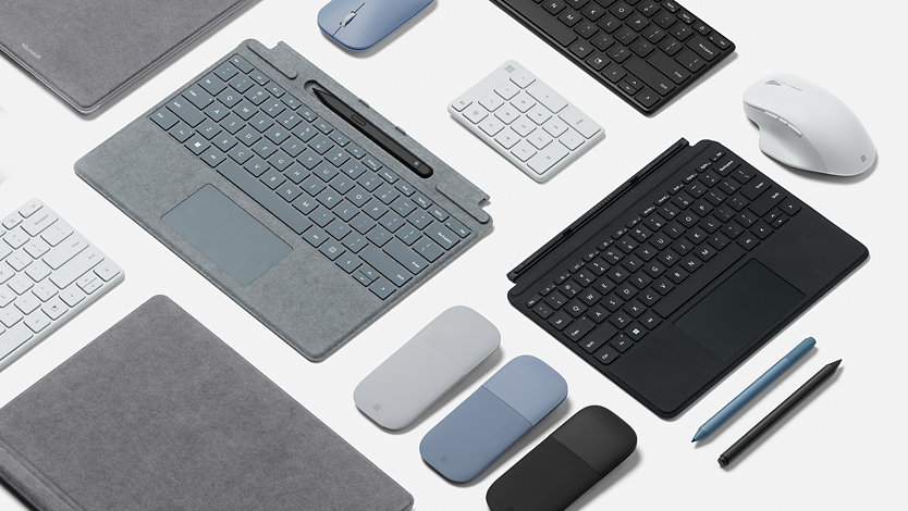Varios accesorios para Surface, como teclado, ratón y lápiz.
