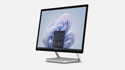 Vista angular do Surface Studio 2+ fechado junto a uma Caneta para Surface.