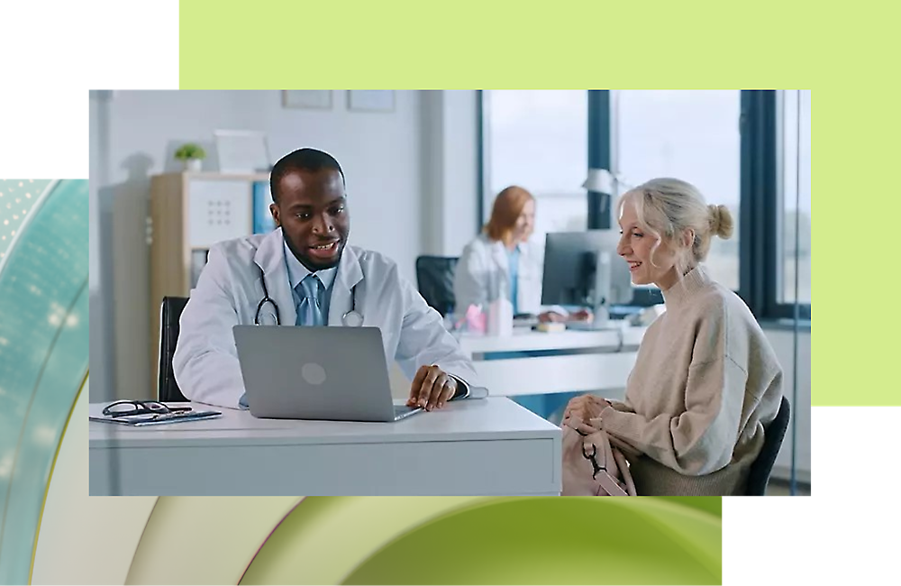 A doctor and a patient looking at a computer