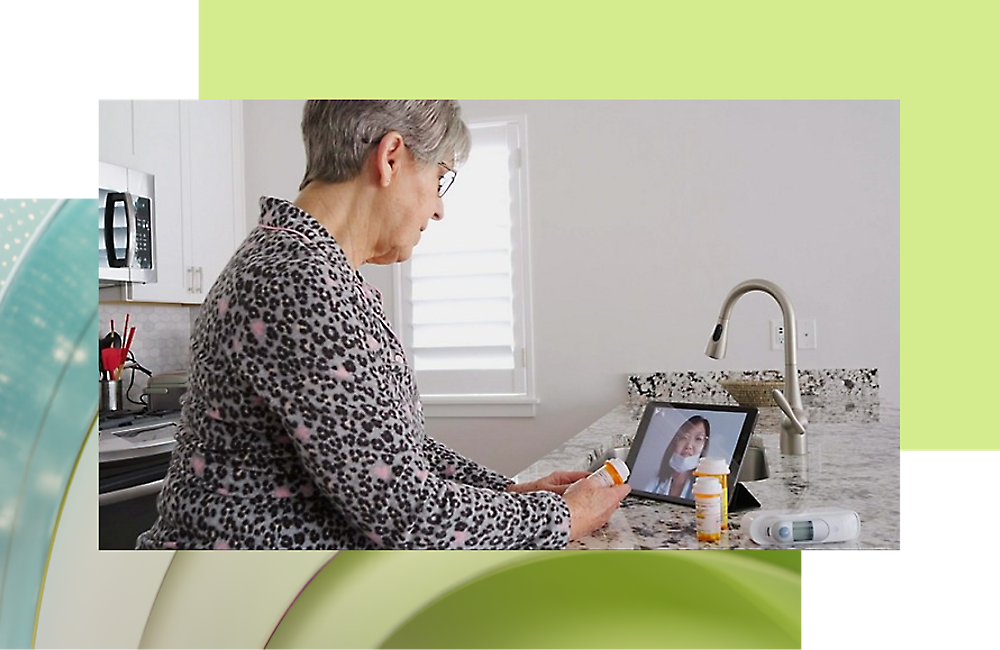 A person looking at a tablet and in a video call