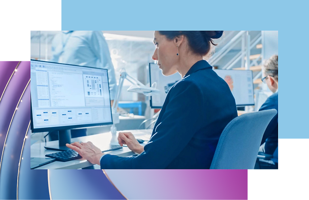 A girl sitting at a desk using a computer