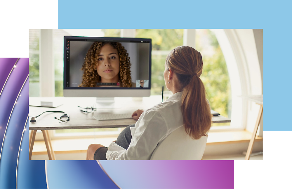 A girl looking at a computer screen and in a video call