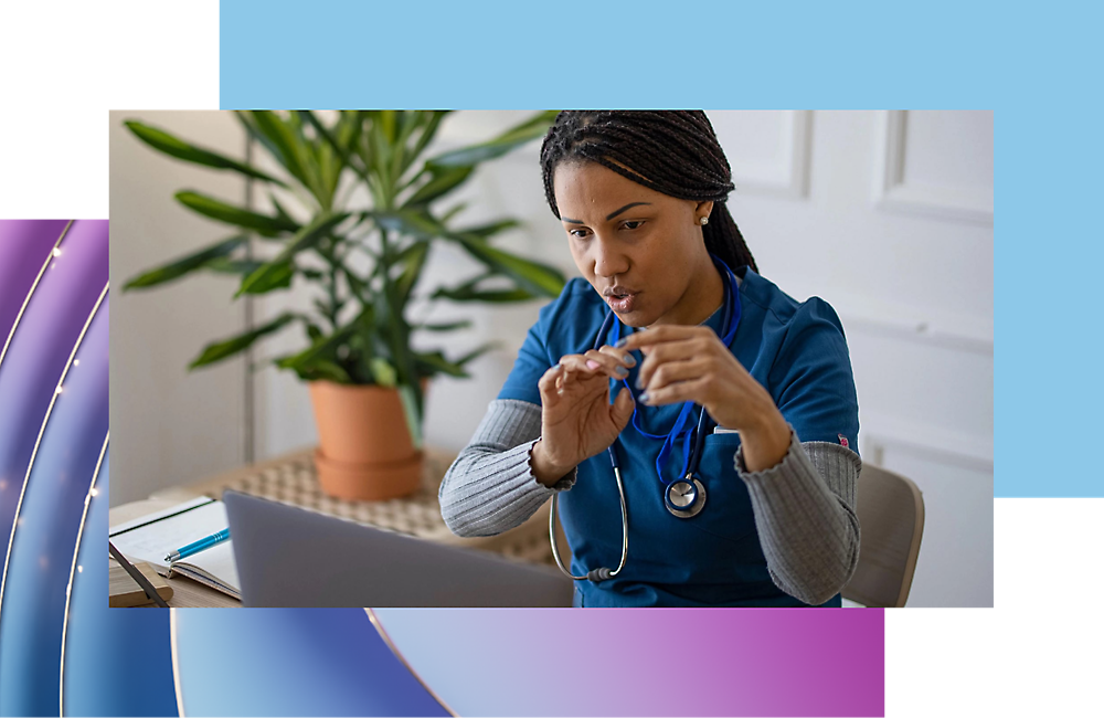 A person in blue scrub holding a stethoscope