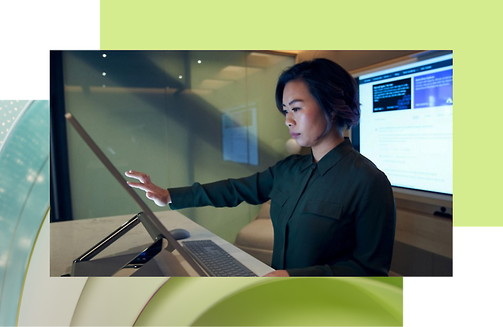 A person working on a touchscreen computer