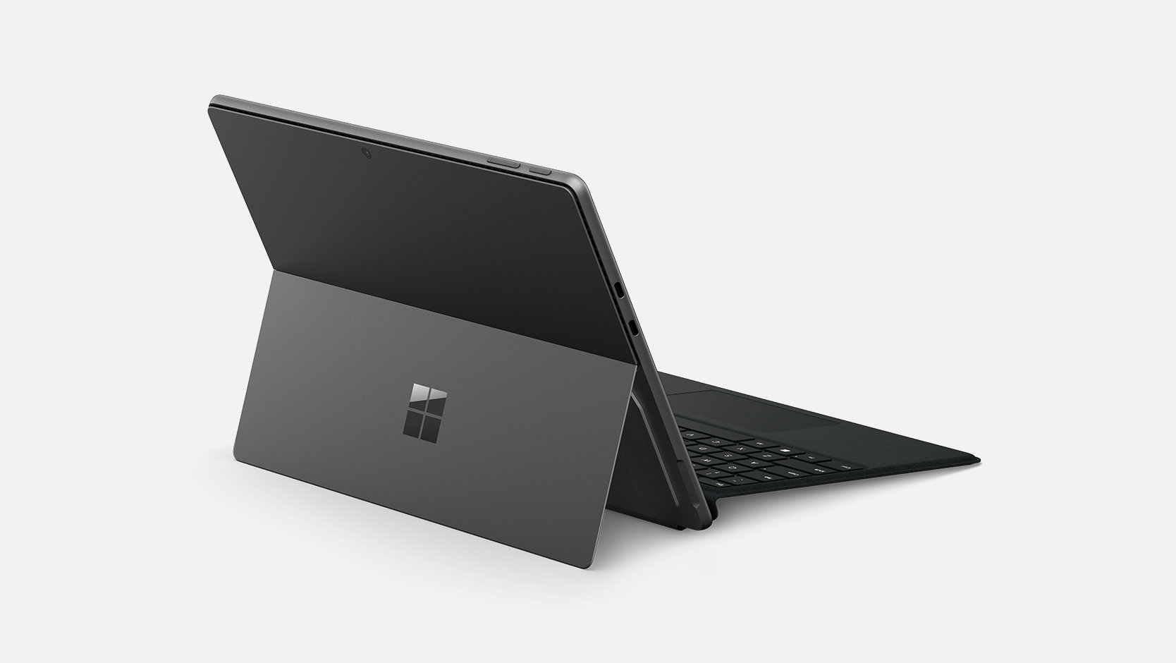 A back angled view shows Surface Pro Keyboard attached to a Surface device.