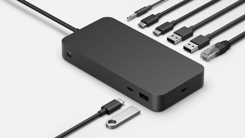 The various ports of a Surface Thunderbolt™ 4 Dock for Business surrounded by various connective cables. 