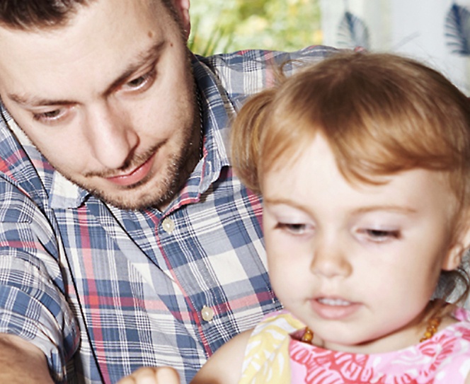 Photo of a person and a child, looks like person is teaching the kid