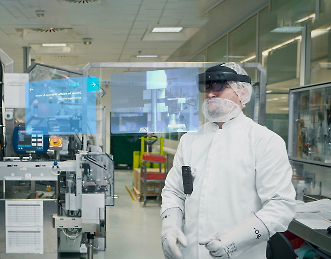 A person in lab wearing safety suit