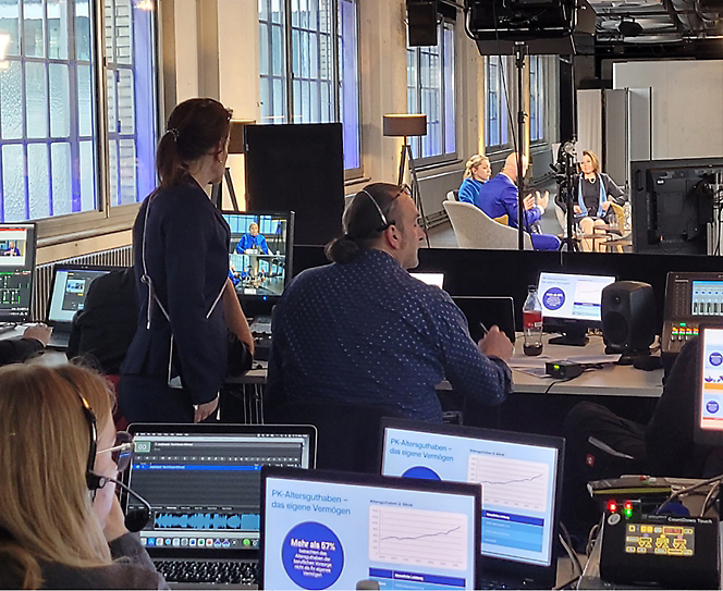 Group of people working in office on their desktops