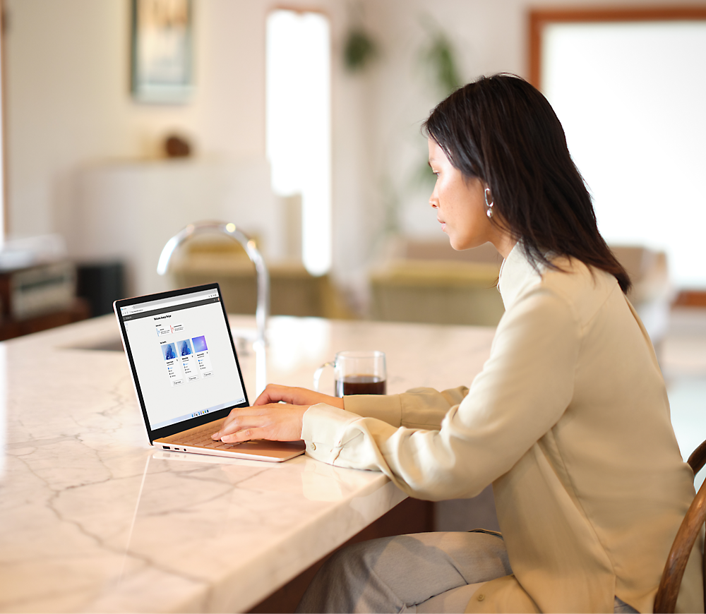 A person sitting and working on laptop