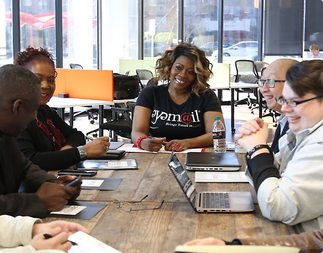 A group of people talking with eatch other