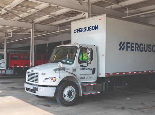 A white Ferguson truck is in a warehouse