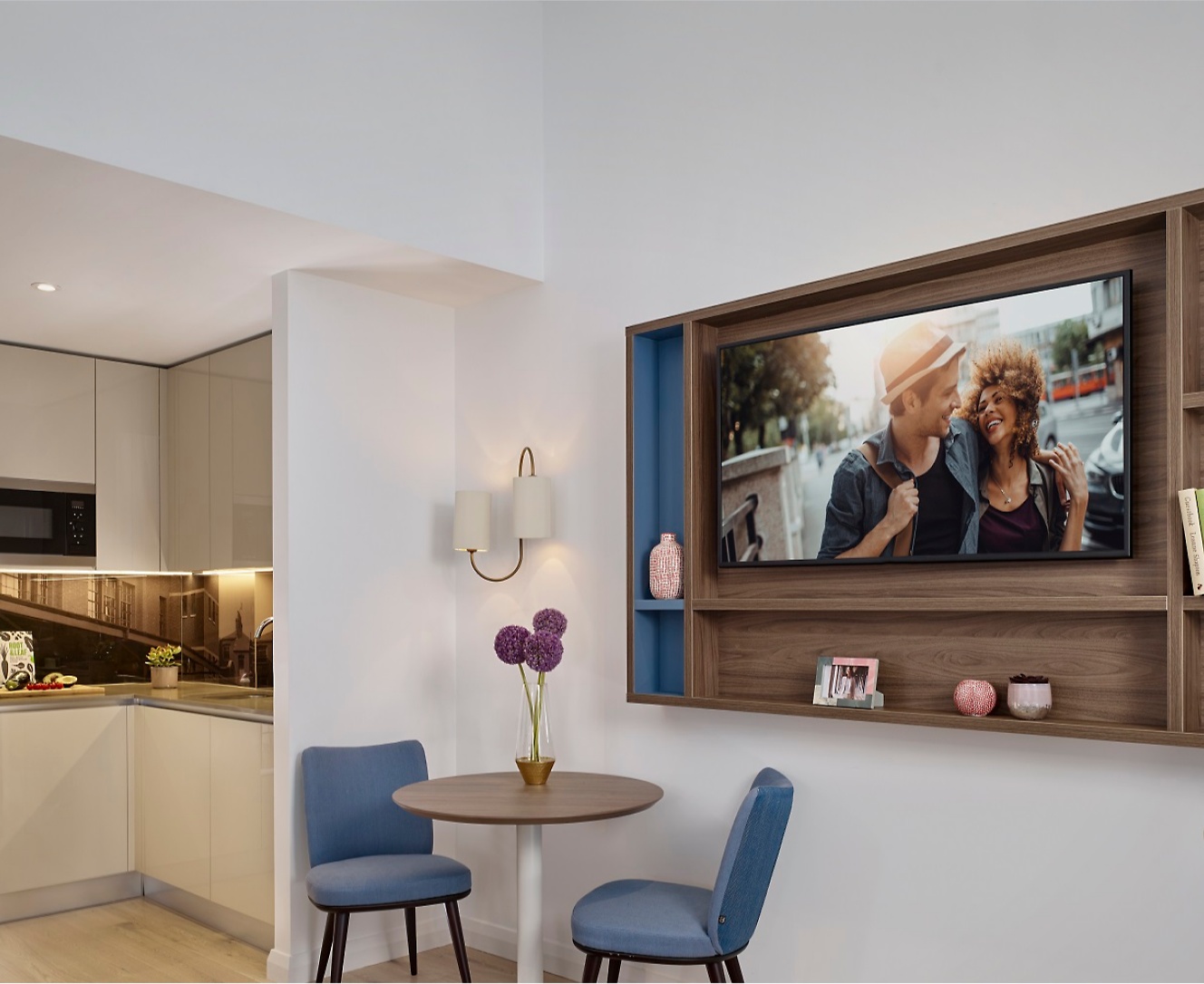 A living room with a tv mounted on the wall.