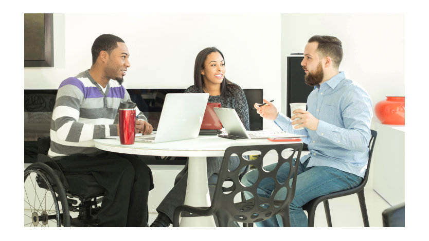 Three colleagues having a business meeting.