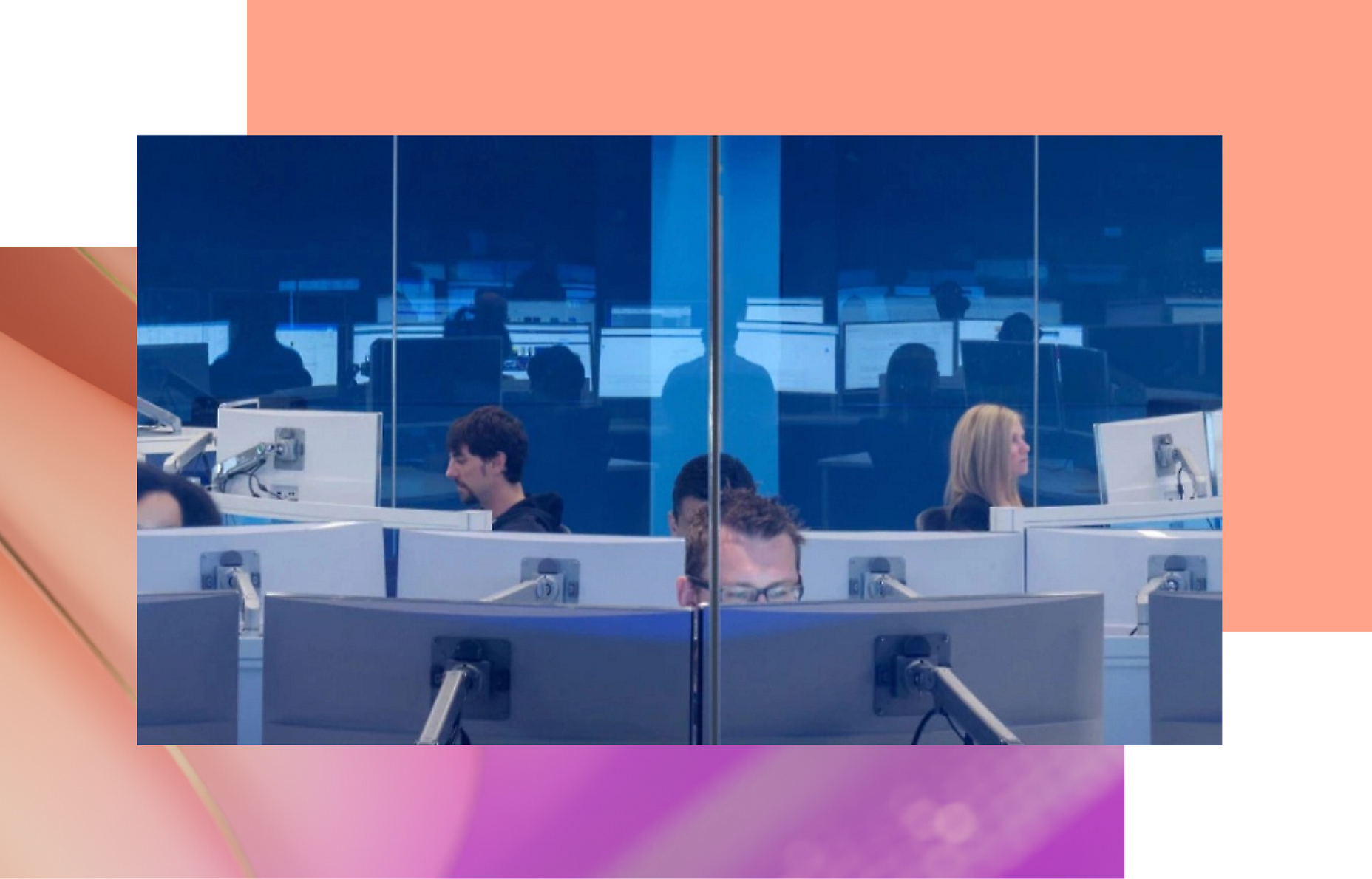 A group of people sitting at computers