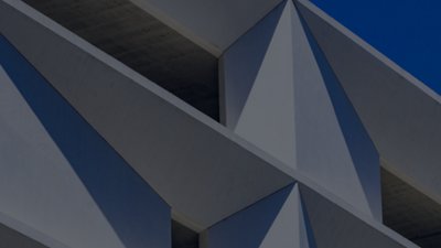 The side of a building with a blue sky.