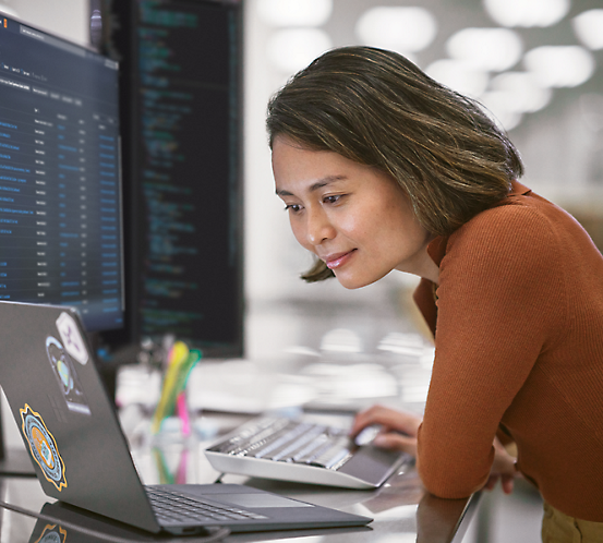 A woman on the computer smiling