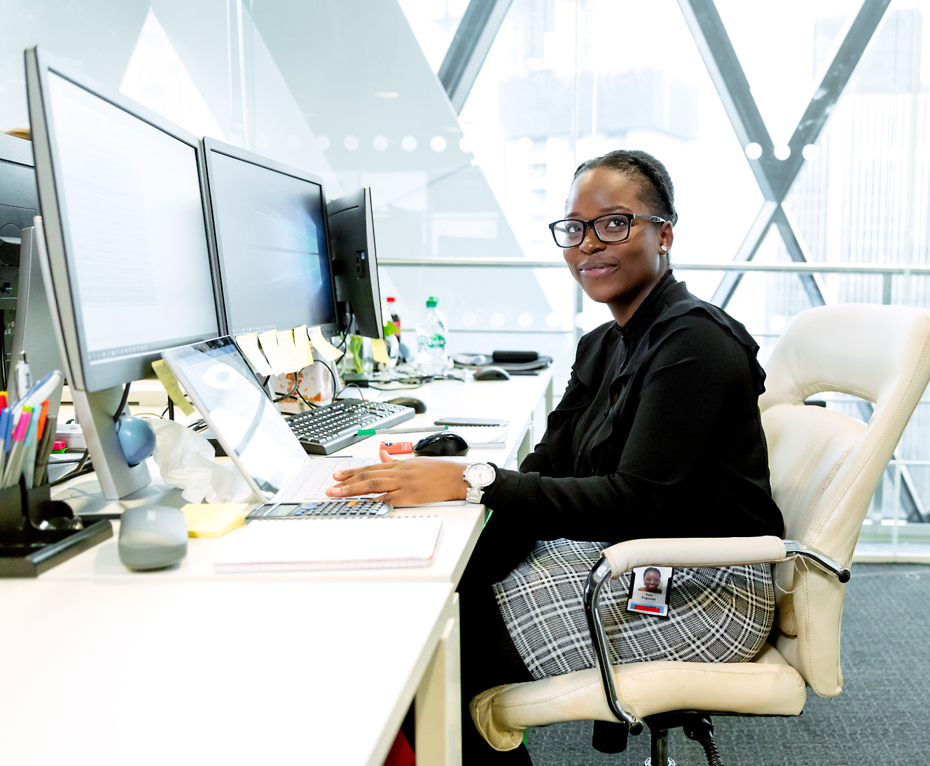 A person sitting at a desk with a computer