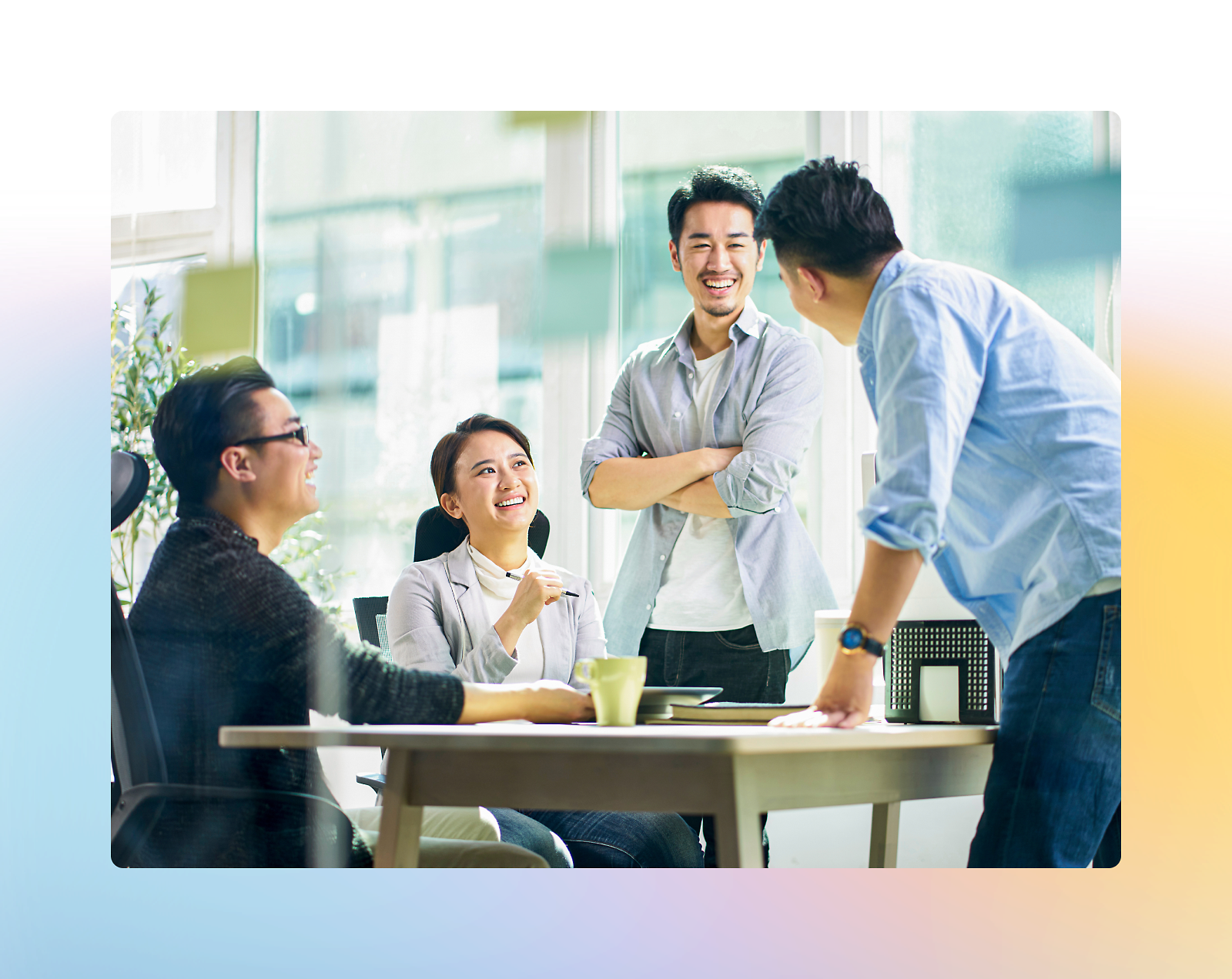 A group of people joyfully talking at a table.