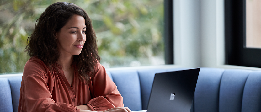 A person looking at a laptop