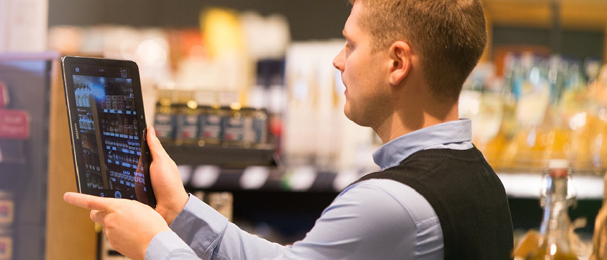 A person using a tablet in a departmental store