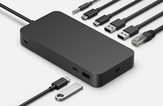 The various ports of Surface Thunderbolt™ 4 Dock surrounded by various connective cables. 